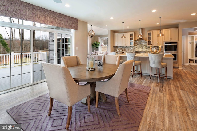 dining area with light hardwood / wood-style flooring