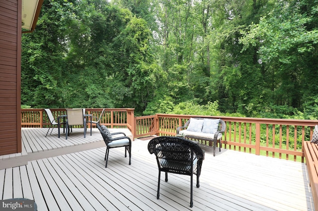 wooden terrace featuring an outdoor living space