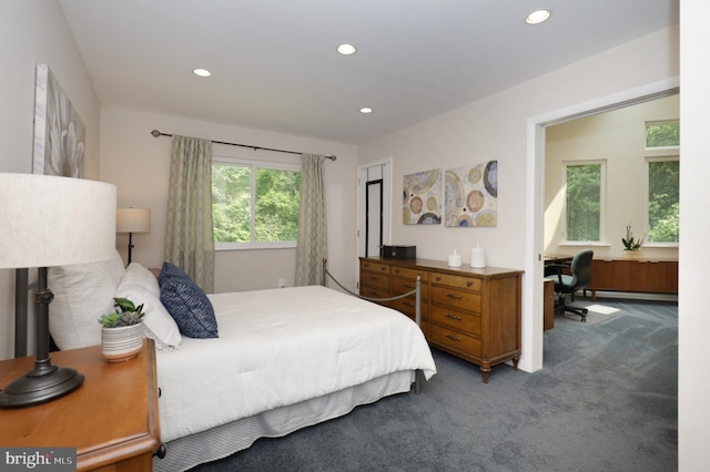 bedroom featuring carpet and a baseboard heating unit