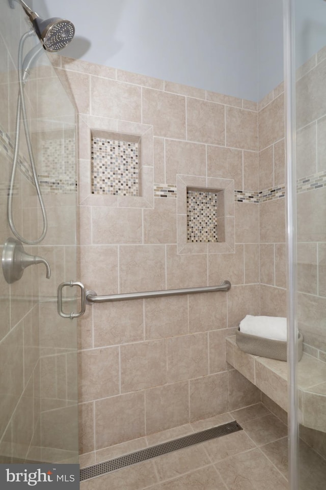 bathroom featuring an enclosed shower