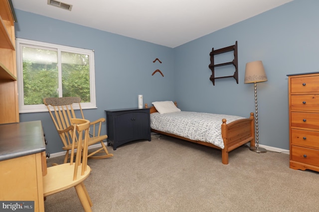 bedroom featuring light colored carpet