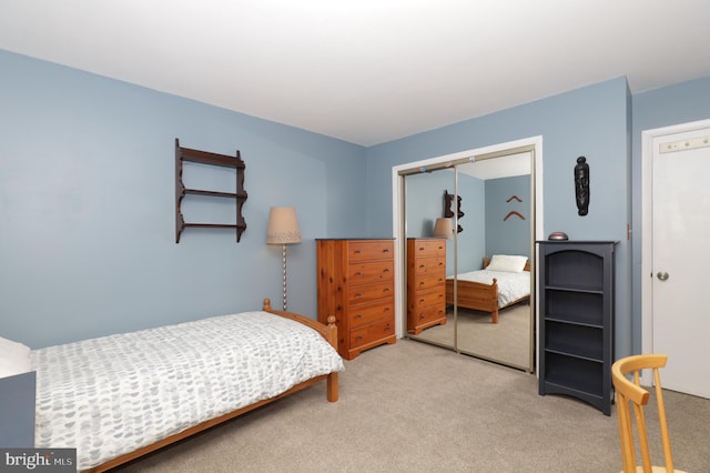 carpeted bedroom with a closet