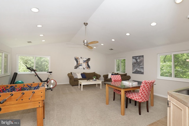 game room featuring light colored carpet, plenty of natural light, lofted ceiling, and ceiling fan