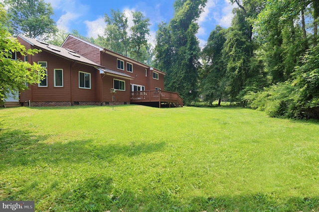 view of yard with a deck