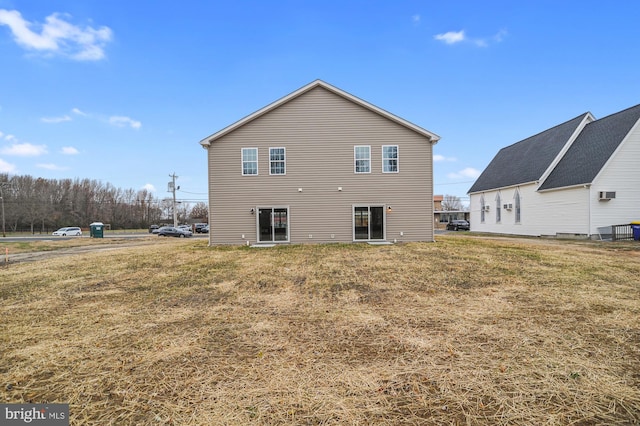 back of house with a yard