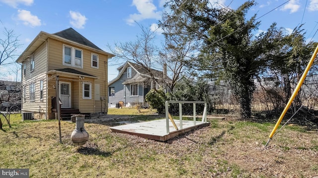 exterior space with entry steps, a deck, and cooling unit