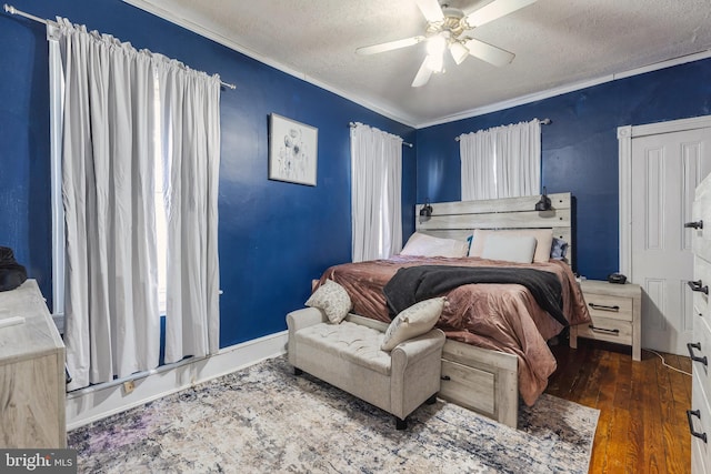 bedroom with a textured ceiling, ceiling fan, crown molding, and dark hardwood / wood-style flooring