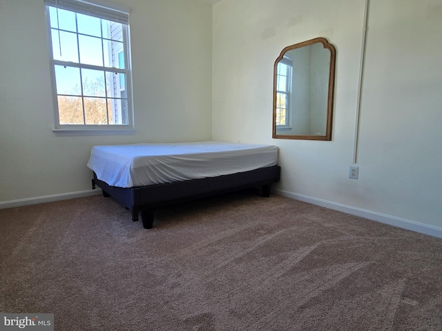 unfurnished bedroom with carpet floors