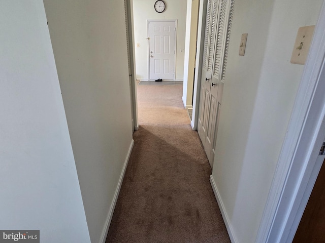 corridor featuring carpet flooring