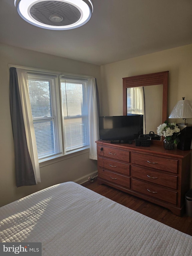 bedroom featuring dark hardwood / wood-style flooring