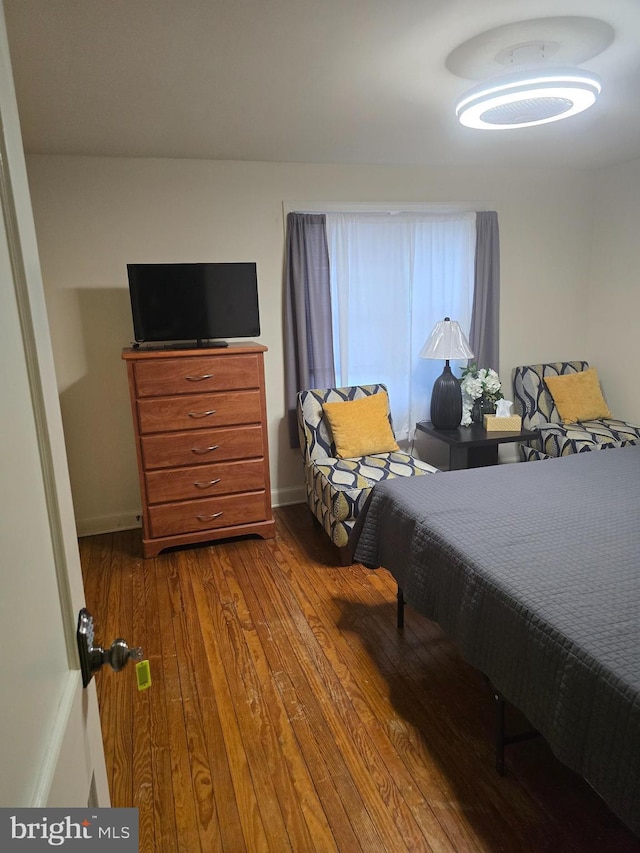 bedroom featuring wood-type flooring