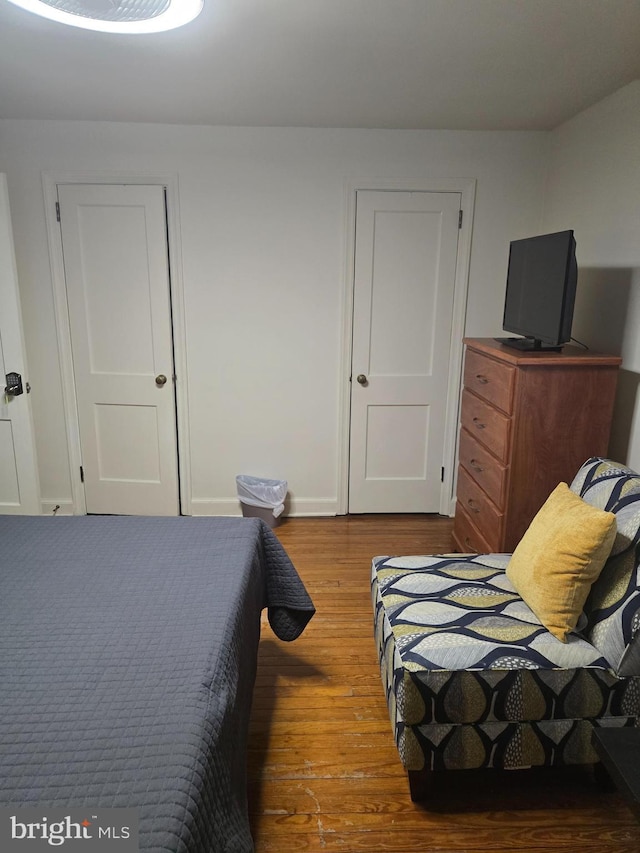 bedroom with hardwood / wood-style flooring