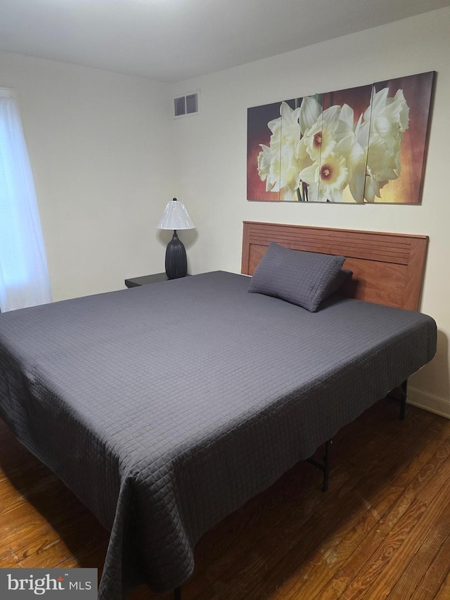 bedroom with wood-type flooring