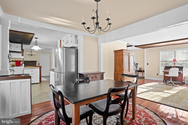 dining area featuring a chandelier and hardwood / wood-style floors