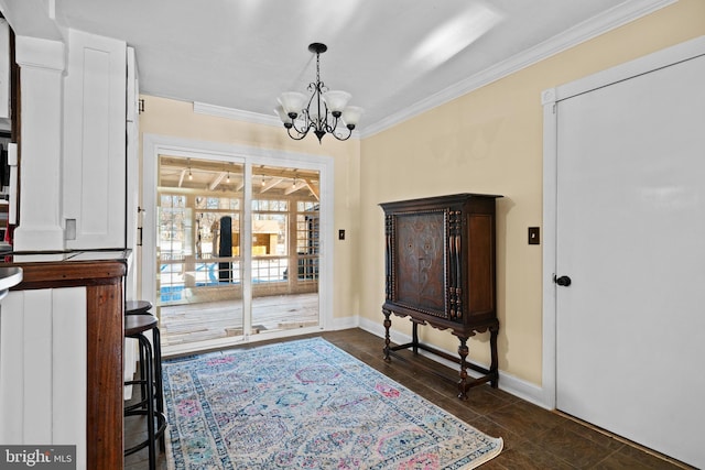 tiled entryway with an inviting chandelier and ornamental molding