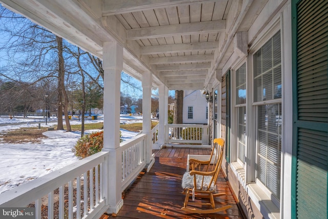 view of snow covered deck