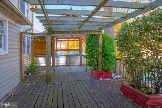 wooden deck featuring a pergola