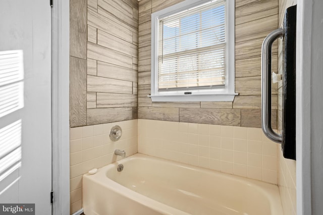 bathroom with plenty of natural light and a bathing tub