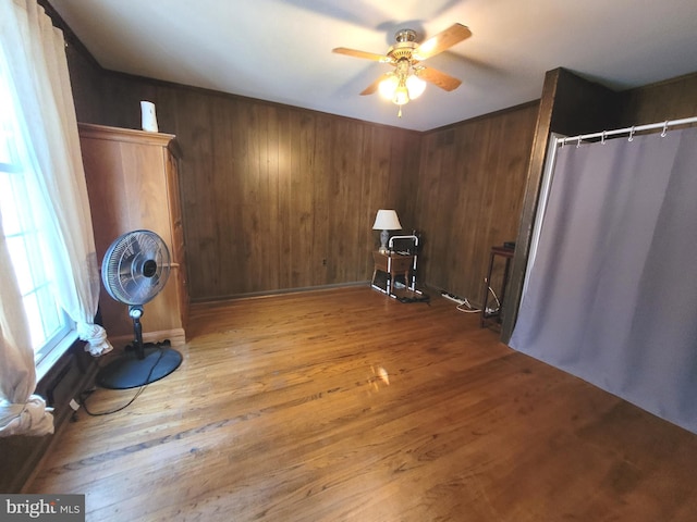 interior space with hardwood / wood-style flooring and ceiling fan