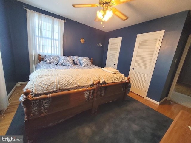 bedroom with ceiling fan and hardwood / wood-style flooring