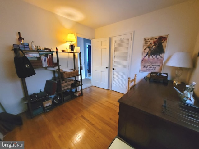 home office with hardwood / wood-style floors