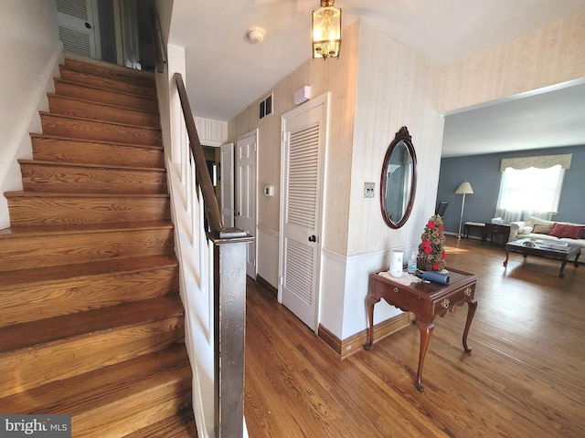 stairway featuring hardwood / wood-style flooring