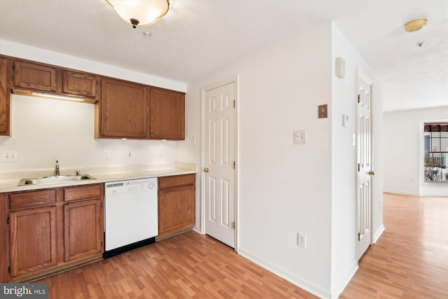 kitchen featuring sink, light hardwood / wood-style flooring, and dishwasher