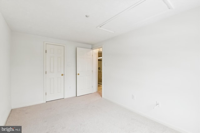 unfurnished bedroom featuring light colored carpet