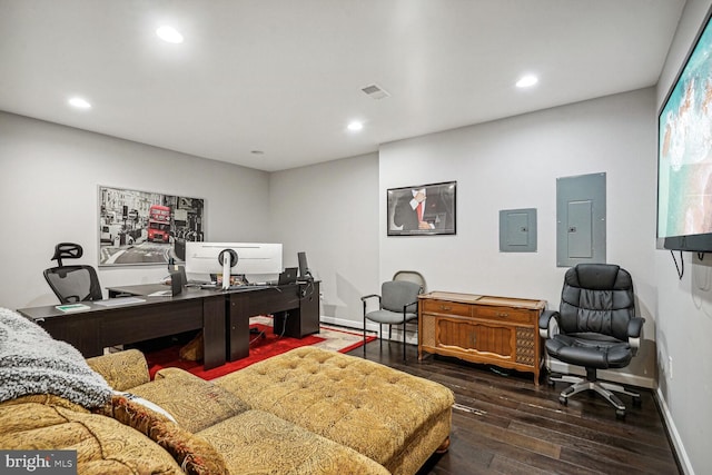 office space featuring dark hardwood / wood-style floors and electric panel