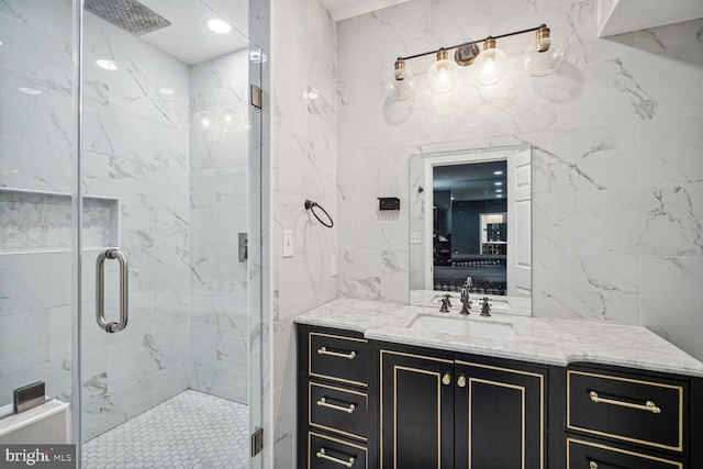 bathroom featuring vanity and a shower with shower door