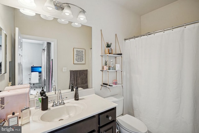 bathroom with vanity and toilet