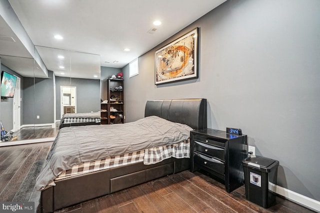 bedroom featuring dark wood-type flooring