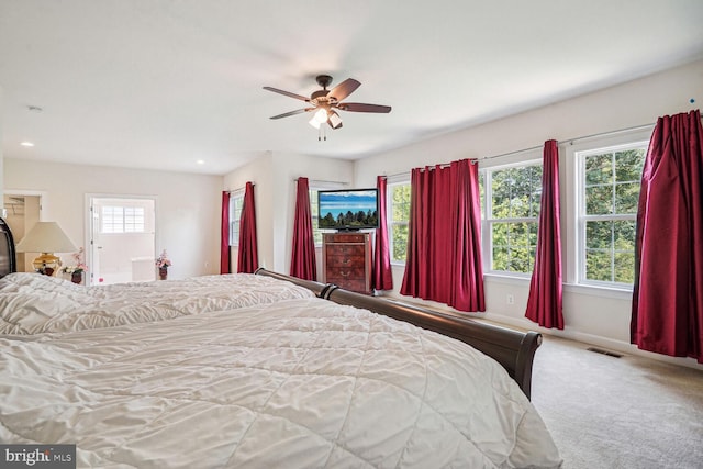 carpeted bedroom featuring ceiling fan