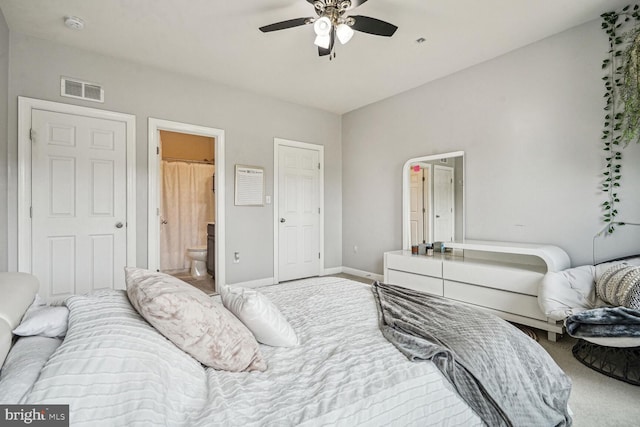 bedroom with carpet, ensuite bathroom, and ceiling fan