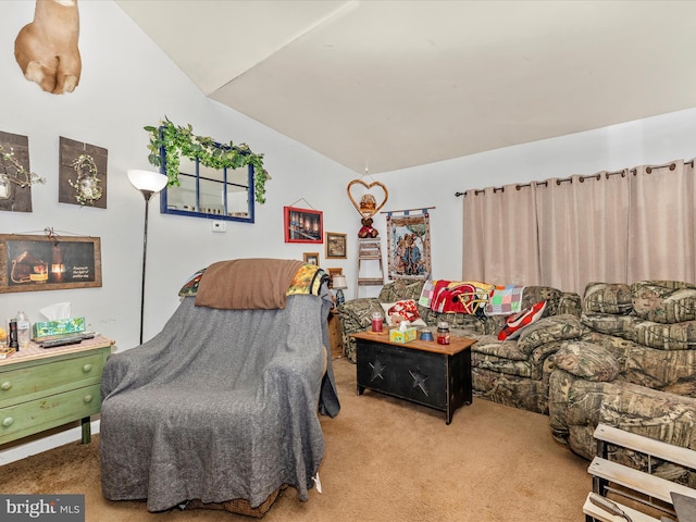 interior space with vaulted ceiling and light carpet