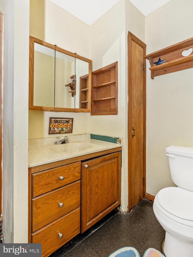 bathroom with toilet and vanity