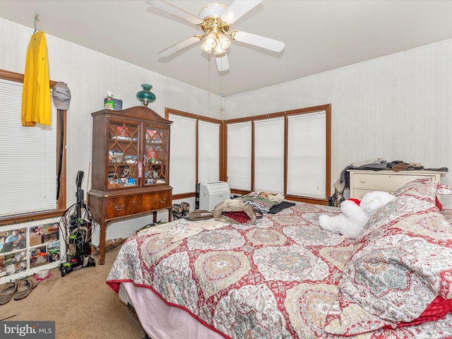 bedroom featuring ceiling fan and carpet floors