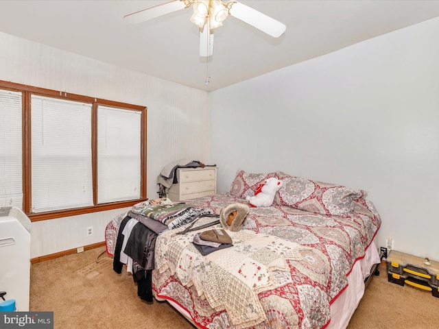 bedroom with light carpet and ceiling fan