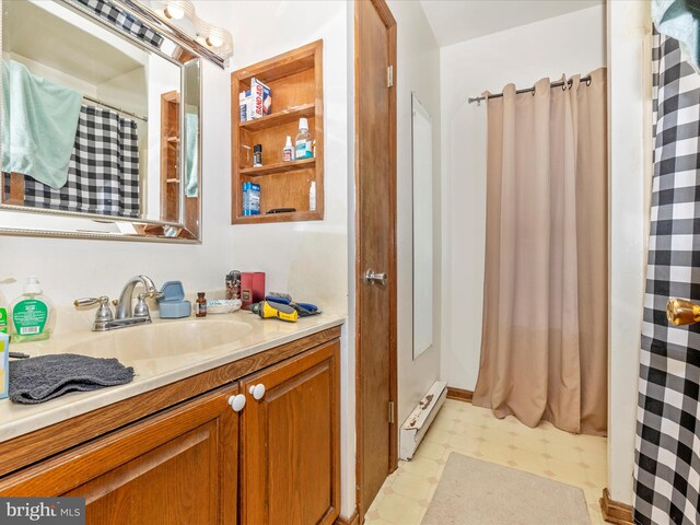 bathroom featuring a baseboard radiator and vanity