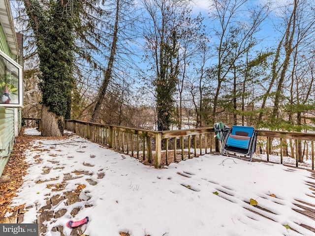 view of snow covered deck