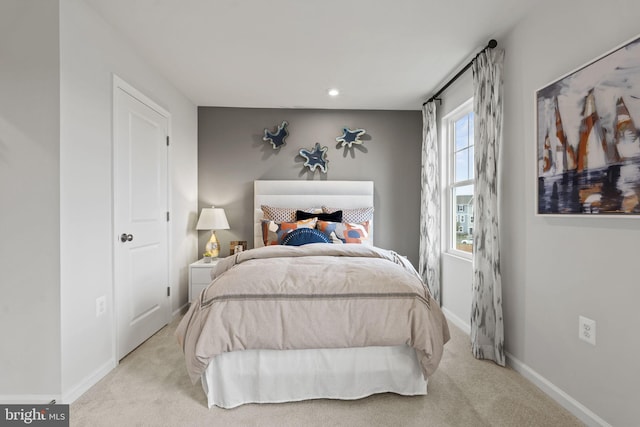 bedroom featuring light carpet