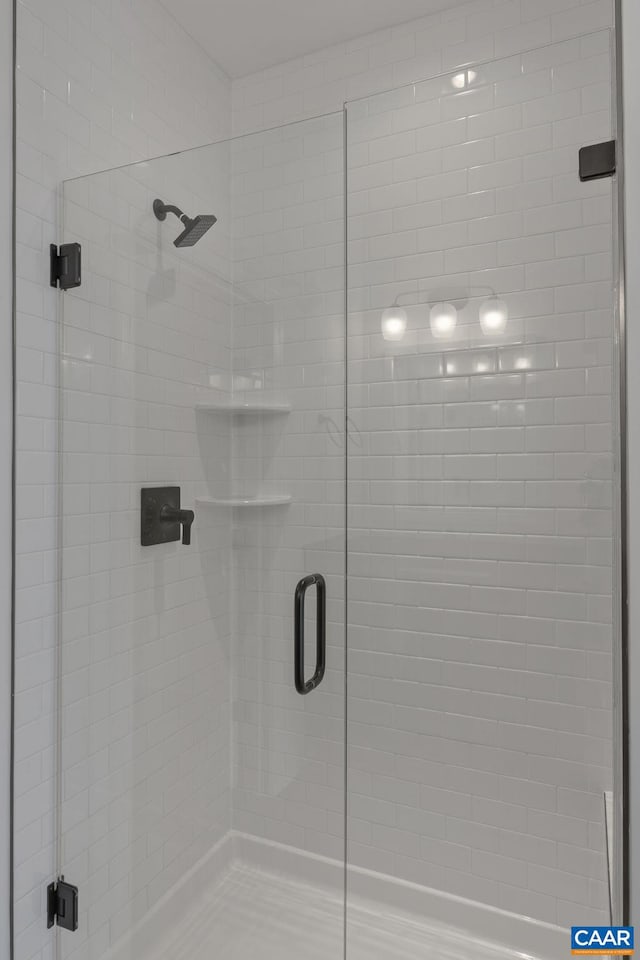 bathroom featuring an enclosed shower