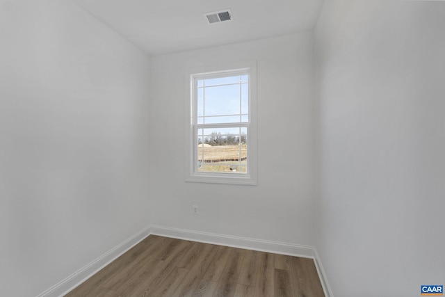 spare room featuring hardwood / wood-style floors