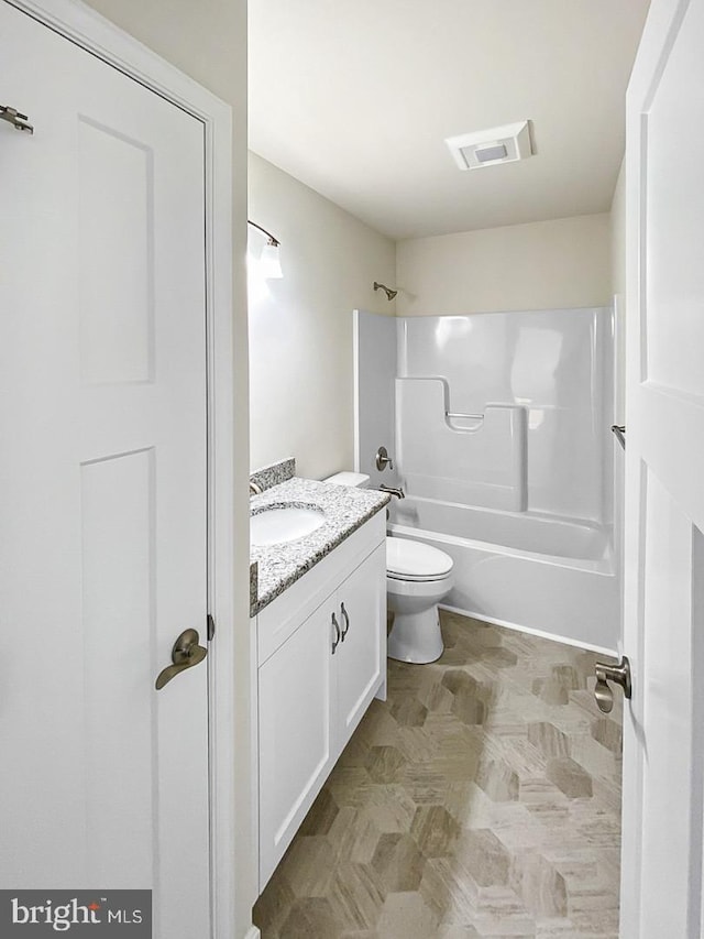 full bathroom featuring vanity, shower / bathtub combination, and toilet