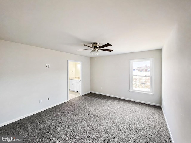 empty room featuring ceiling fan and carpet floors