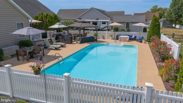 view of swimming pool featuring a patio area, a gazebo, and outdoor lounge area