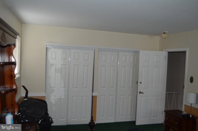 bedroom featuring two closets