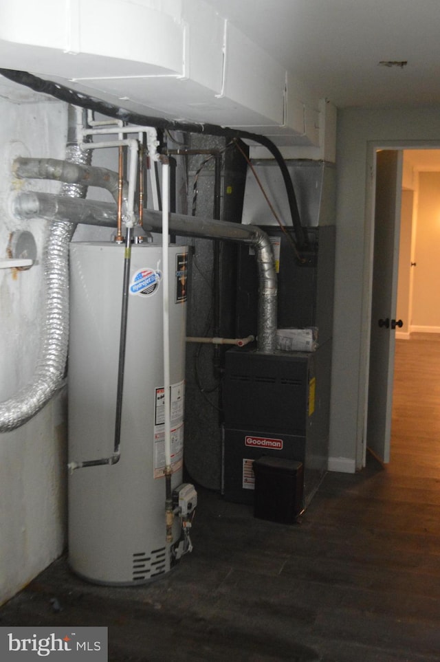 utility room with gas water heater and heating unit