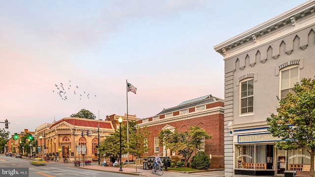 view of outdoor building at dusk