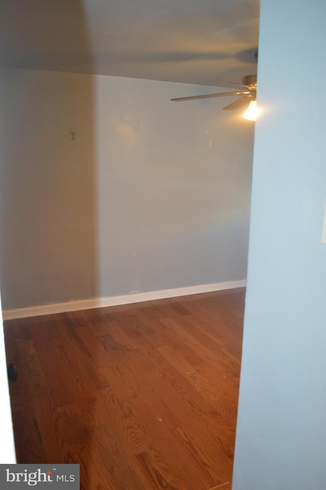 empty room with hardwood / wood-style floors